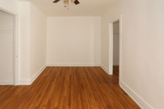 4604 North Beacon Street, Unit 3E Chicago, IL 60640 - Photo 7 of 13 a view of a room with wooden floor