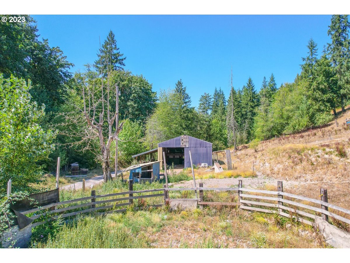 69802 Marcott Road Rainier, OR 97048 - Photo 8 of 10 a view of a house with a yard