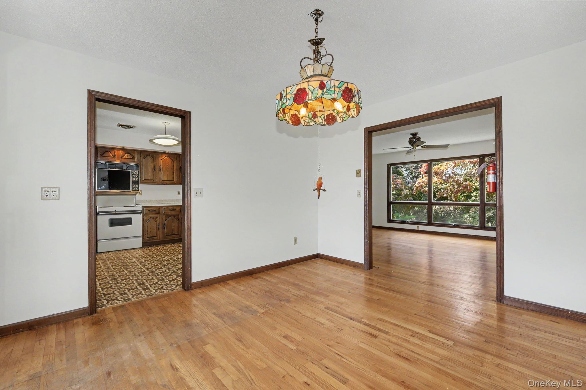 214 Starr Ridge Road Brewster, NY 10509 - Photo 13 of 37 Dining room with hard wood floors leading to kitchen and living room