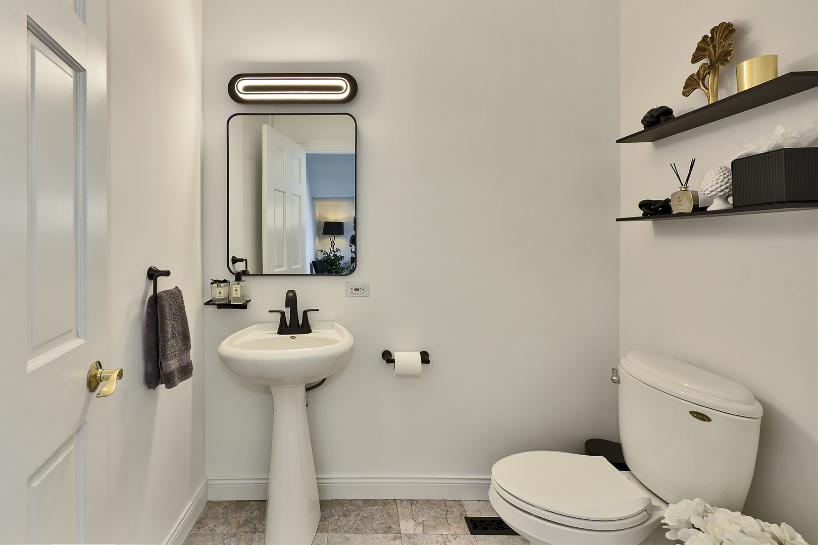 144 North Highland Road Inverness, IL 60067 - Photo 28 of 49 a bathroom with a sink a mirror and a toilet