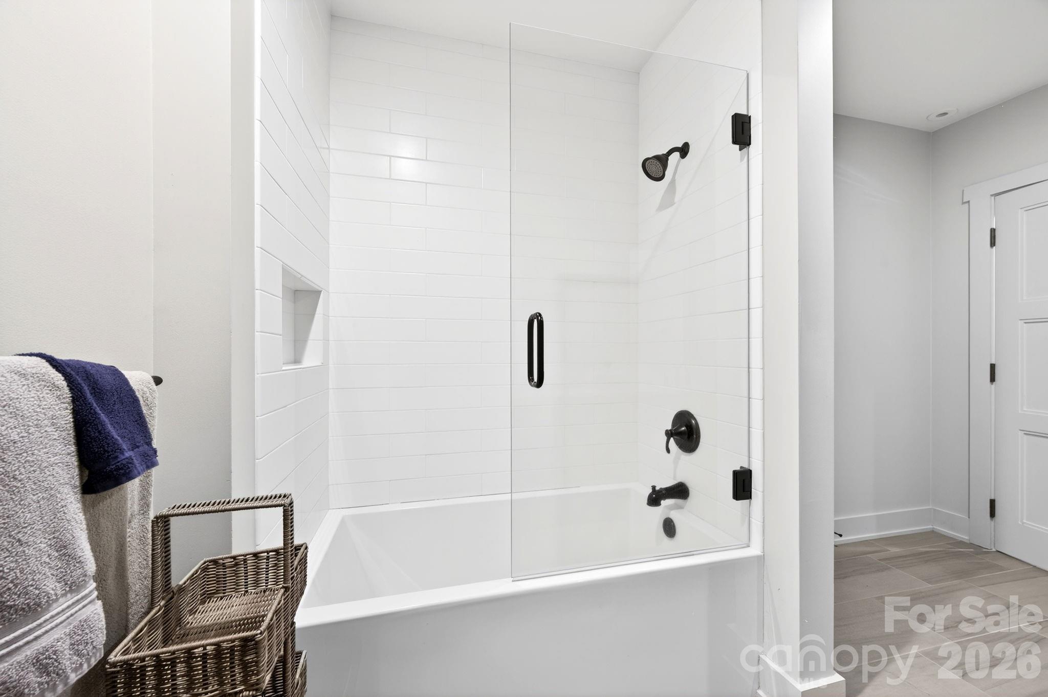 235 Bull Creek Road Asheville, NC 28805 - Photo 28 of 47 a bathroom with a bathtub and a shower