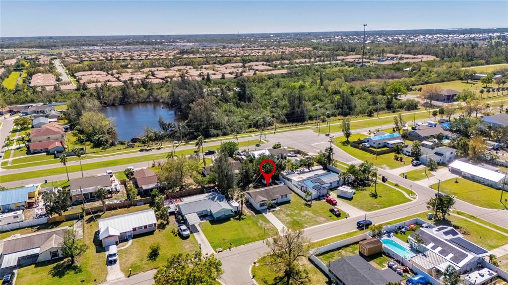 564 Florida Circle South Apollo Beach, FL 33572 - Photo 2 of 46 an aerial view of a house with a swimming pool outdoor seating and yard