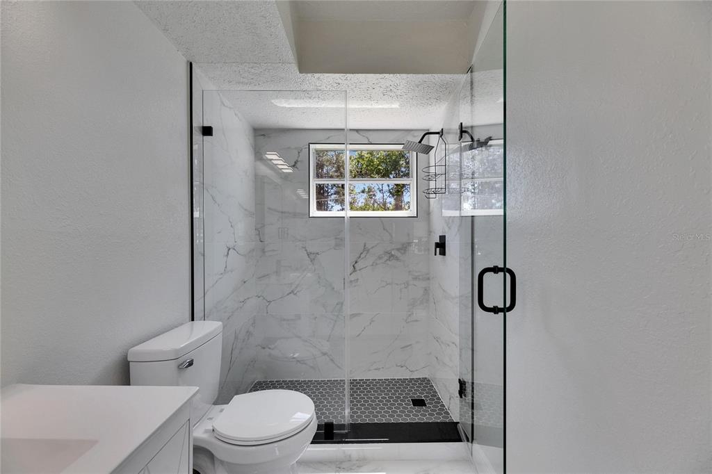 564 Florida Circle South Apollo Beach, FL 33572 - Photo 31 of 46 a bathroom with a toilet and a shower