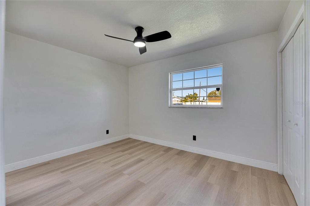 564 Florida Circle South Apollo Beach, FL 33572 - Photo 36 of 46 an empty room with a window and a ceiling fan