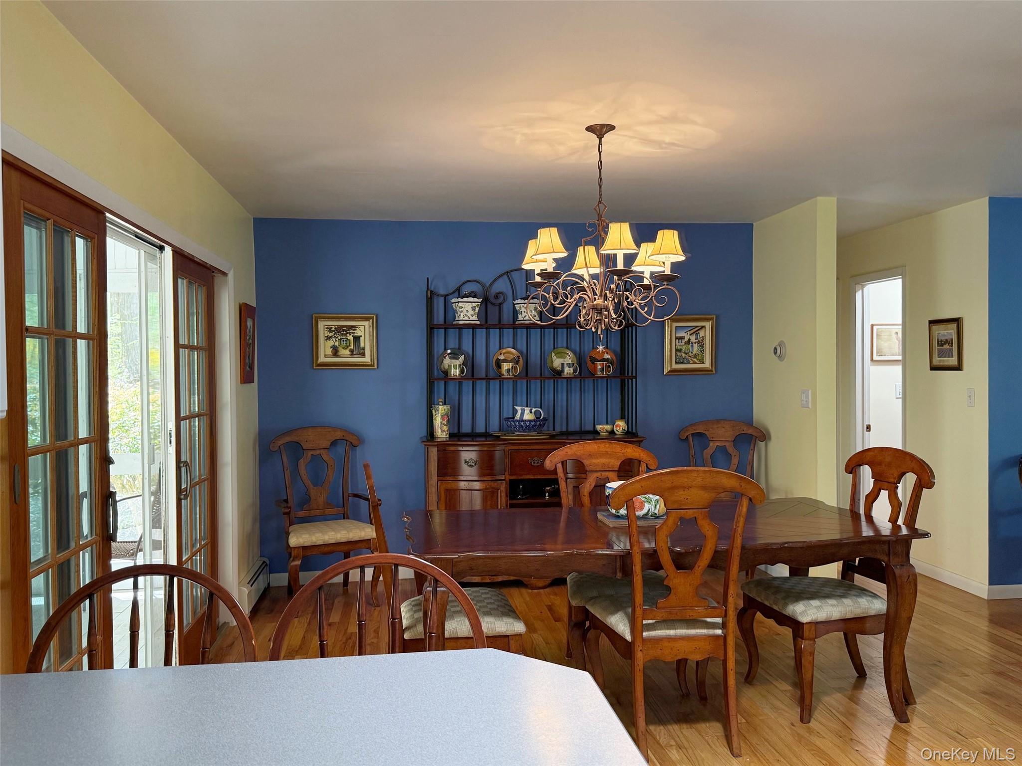 230 Cooper Road Millerton, NY 12546 - Photo 8 of 20 a view of a dining room with furniture and chandelier