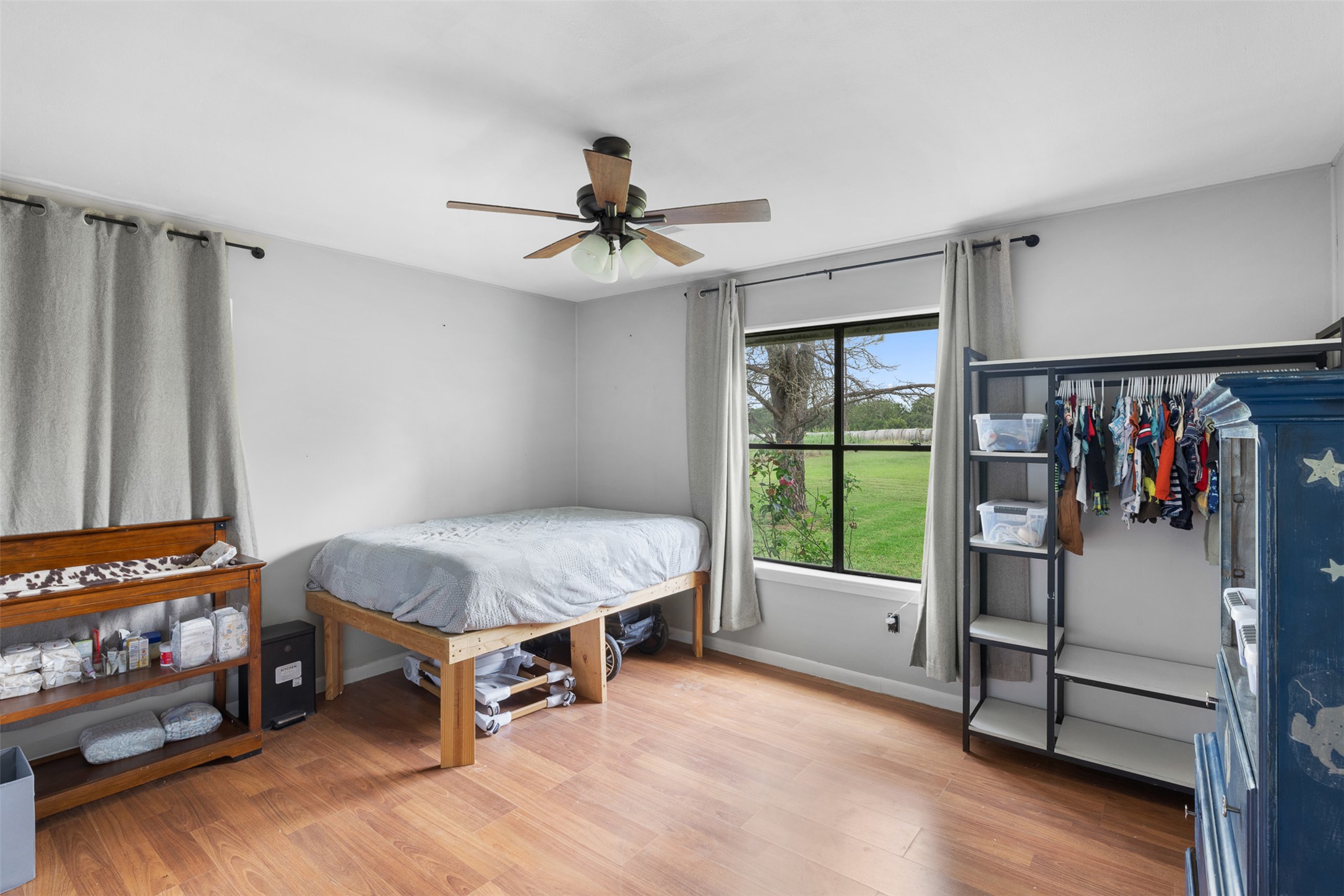 1015 FM 112 Road Lexington, TX 78947 - Photo 11 of 38 a bedroom with furniture and a window