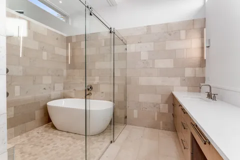 a close view of a sink and cabinets