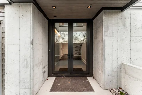 a kitchen with stainless steel appliances a sink and a refrigerator