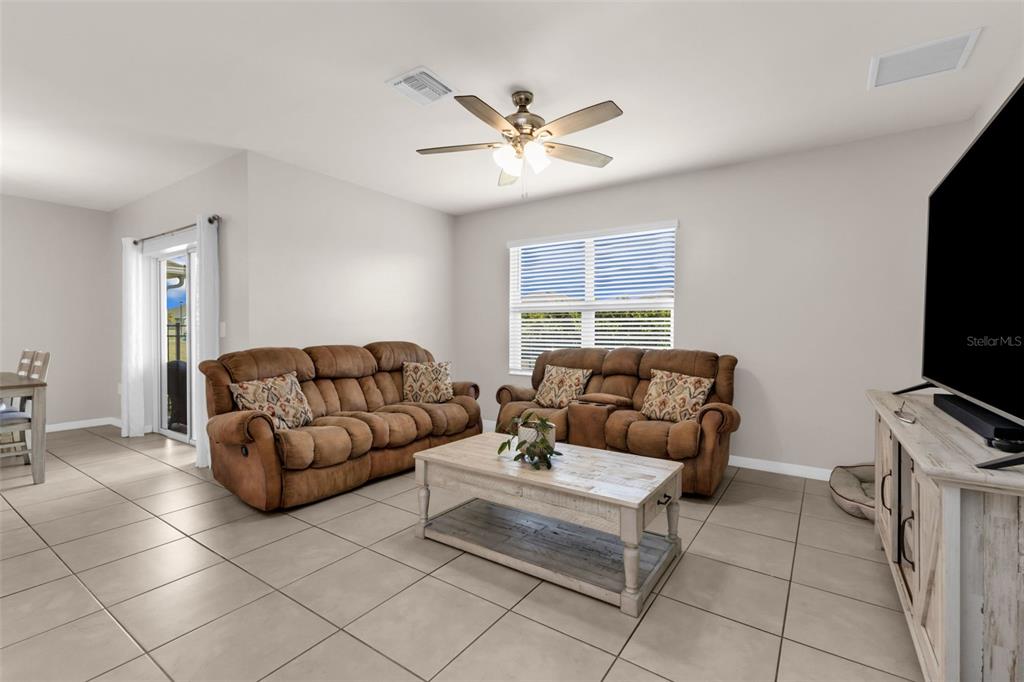 4219 Manatee Lane Punta Gorda, FL 33980 - Photo 14 of 56 a living room with furniture and a flat screen tv