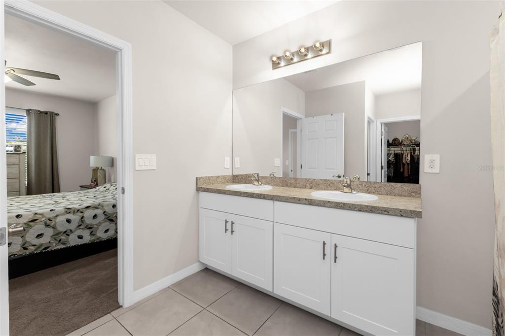 4219 Manatee Lane Punta Gorda, FL 33980 - Photo 20 of 56 a en suite bathroom with a sink and a mirror
