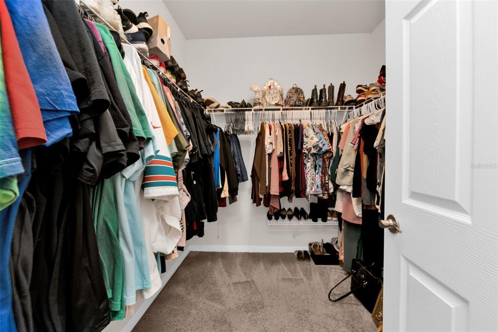 4219 Manatee Lane Punta Gorda, FL 33980 - Photo 22 of 56 a view of walk in closet with clothes and shoes