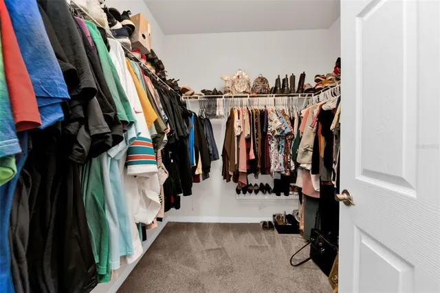 an aerial view of residential houses with outdoor space and street view