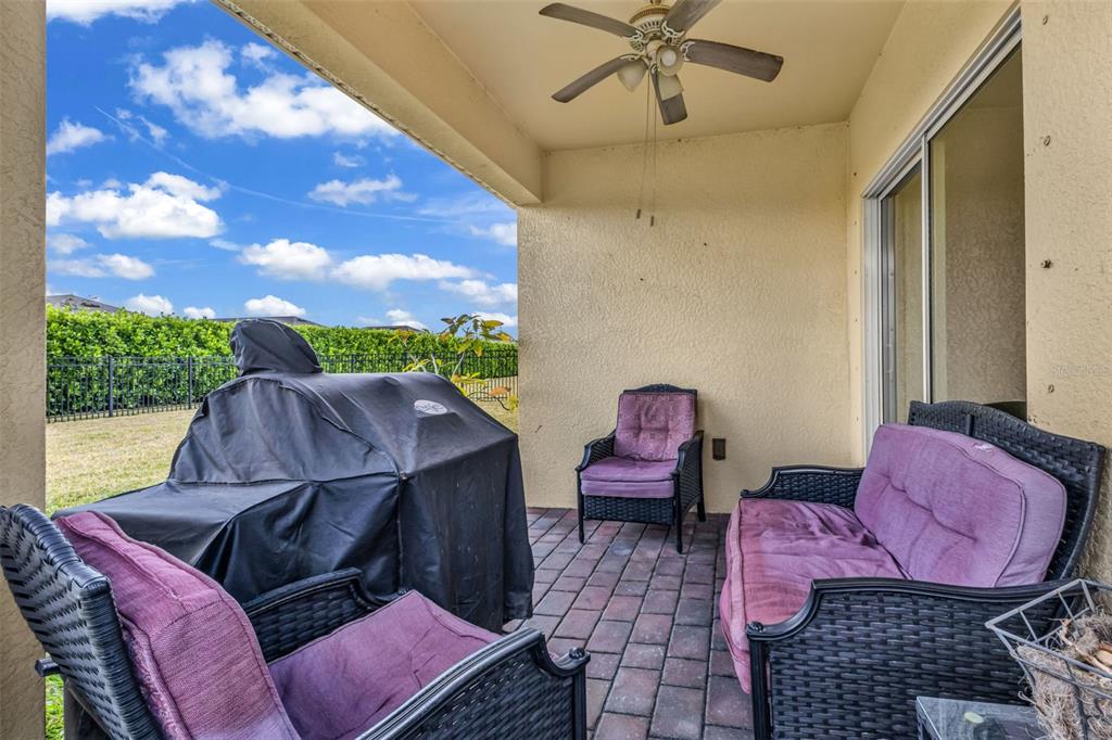 4219 Manatee Lane Punta Gorda, FL 33980 - Photo 32 of 56 a view of a balcony with chair and a barbeque