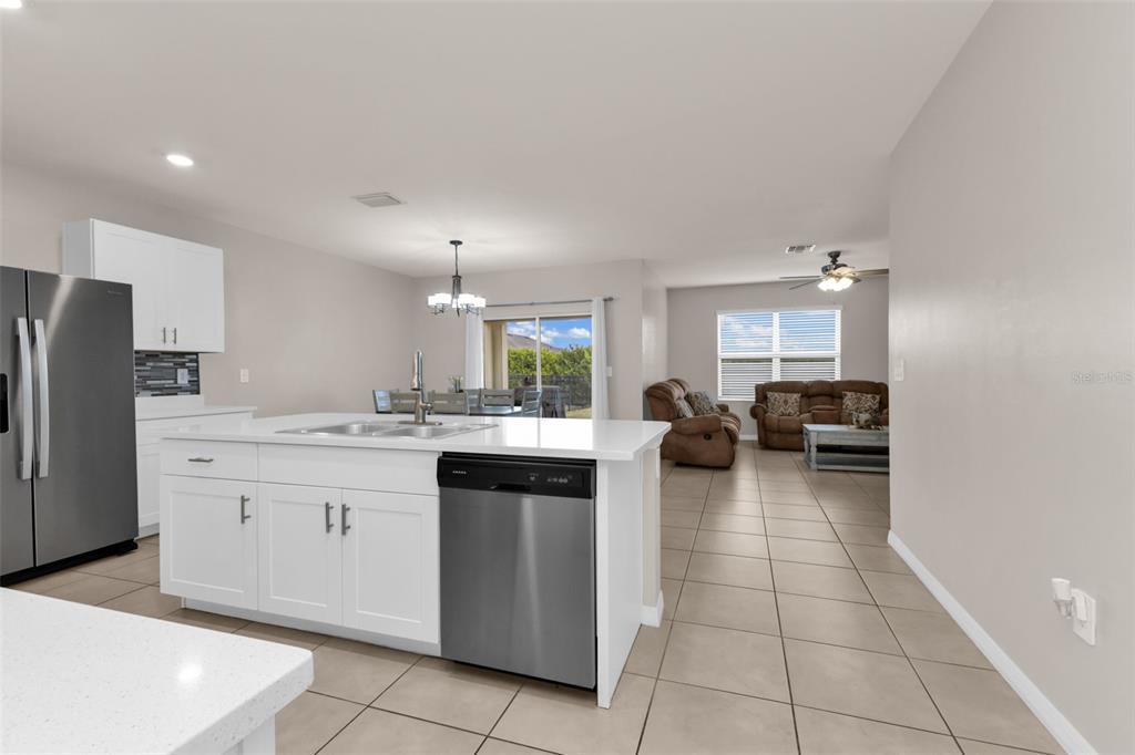 4219 Manatee Lane Punta Gorda, FL 33980 - Photo 7 of 56 a kitchen with a sink cabinets and stainless steel appliances