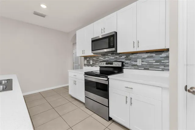 a en suite bathroom with a sink and a mirror