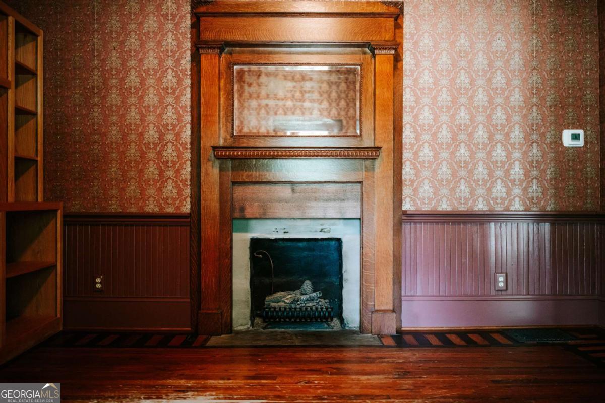 212 Yancey Road Arnoldsville, GA 30619 - Photo 13 of 50 a living room with a fireplace