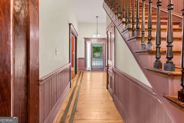 a view of staircase with a glass door