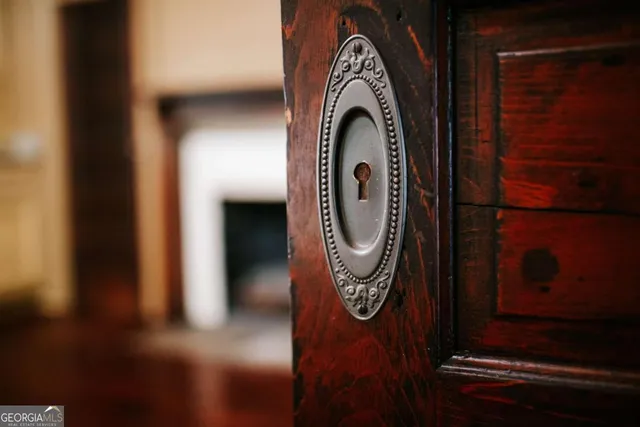 a kitchen with granite countertop wooden floors stainless steel appliances and cabinets