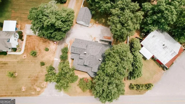 an aerial view of a house with outdoor space