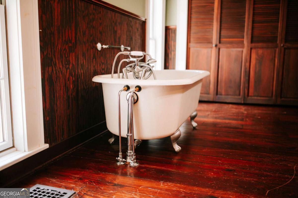212 Yancey Road Arnoldsville, GA 30619 - Photo 31 of 50 a view of a dining room with furniture window and wooden floor