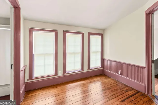 a view of a hallway view with wooden floor