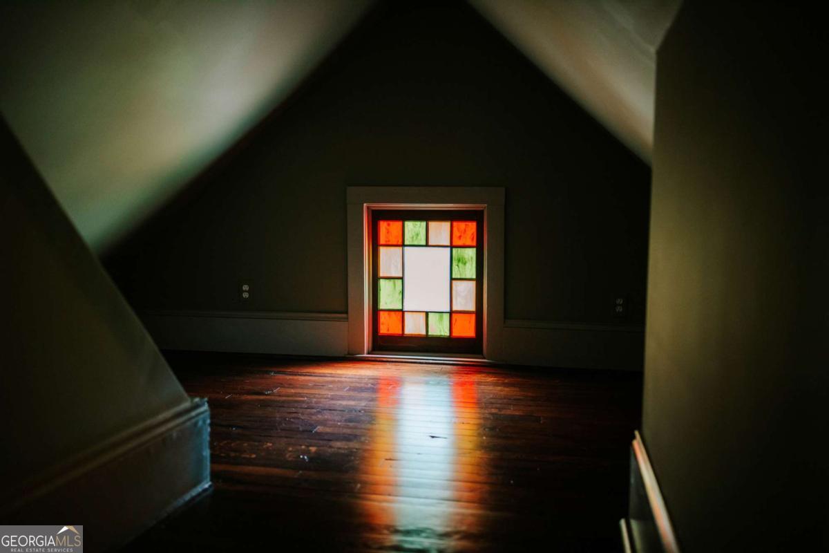 212 Yancey Road Arnoldsville, GA 30619 - Photo 35 of 50 a view of a room with wooden floor and a window