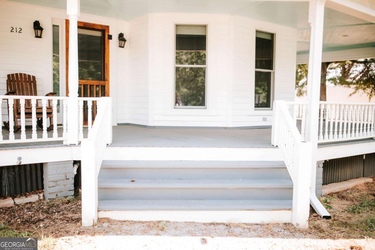 212 Yancey Road Arnoldsville, GA 30619 - Photo 4 of 50 a bathroom with a bathtub and a window