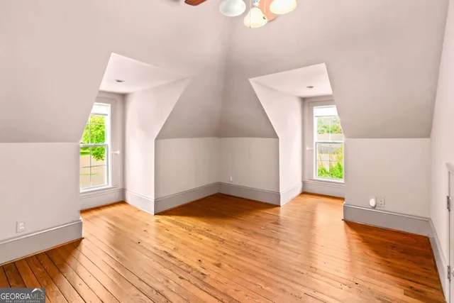 a bathroom with a toilet a sink and a mirror