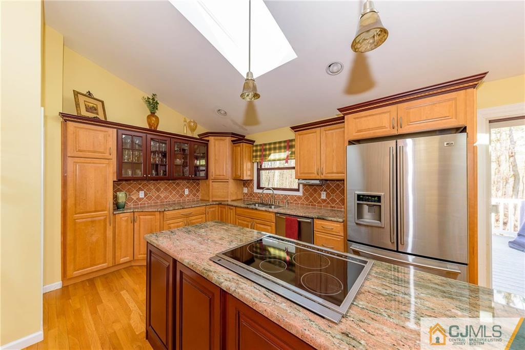 82 Jacobs Road Rockaway, NJ 07866 - Photo 14 of 25 a kitchen filled with stainless steel appliances granite countertop a refrigerator and a stove