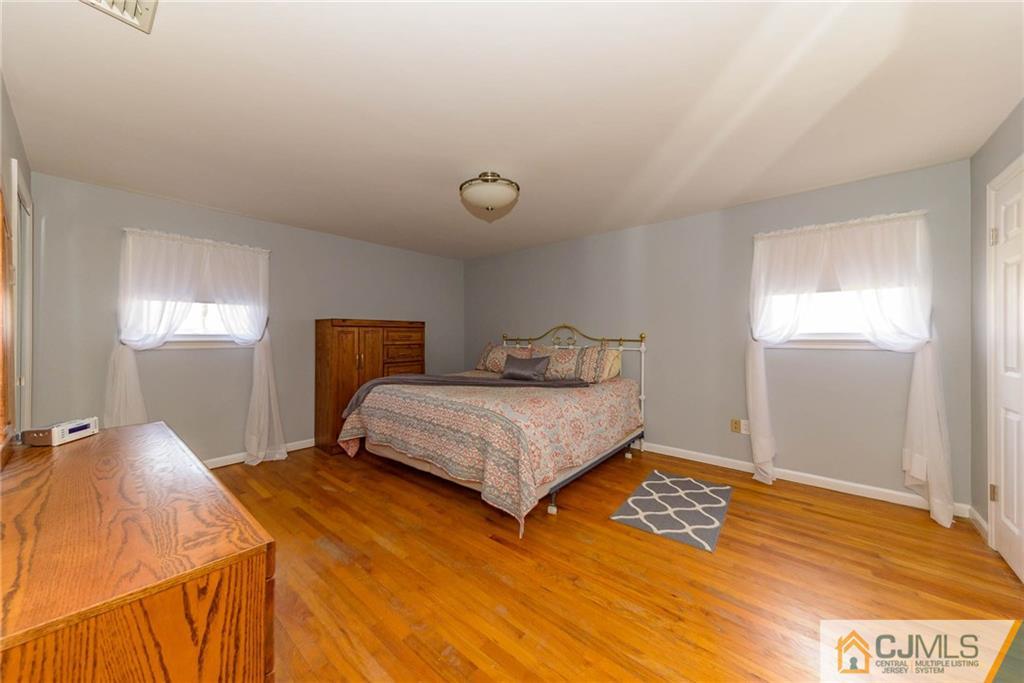82 Jacobs Road Rockaway, NJ 07866 - Photo 15 of 25 a bedroom with a bed and wooden floor