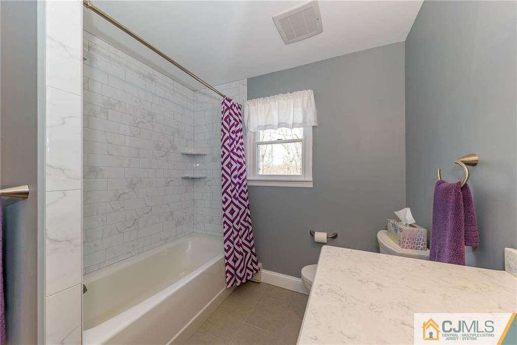 82 Jacobs Road Rockaway, NJ 07866 - Photo 18 of 25 a bathroom with a bathtub sink and toilet