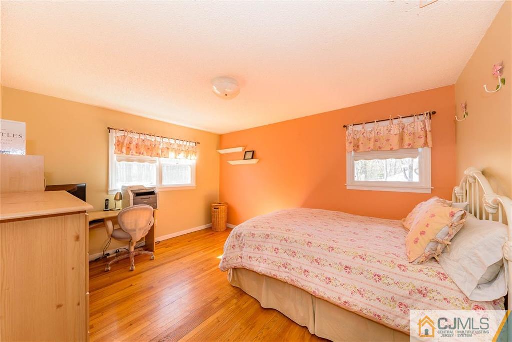 82 Jacobs Road Rockaway, NJ 07866 - Photo 19 of 25 a bedroom with a bed and wooden floor