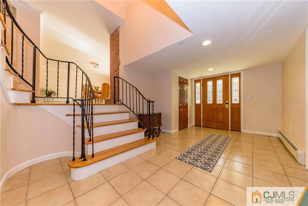 82 Jacobs Road Rockaway, NJ 07866 - Photo 3 of 25 a view of entryway with stairs and a rug