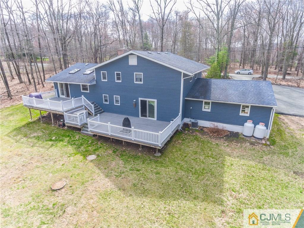 82 Jacobs Road Rockaway, NJ 07866 - Photo 23 of 25 a view of a house with a yard plants and large tree
