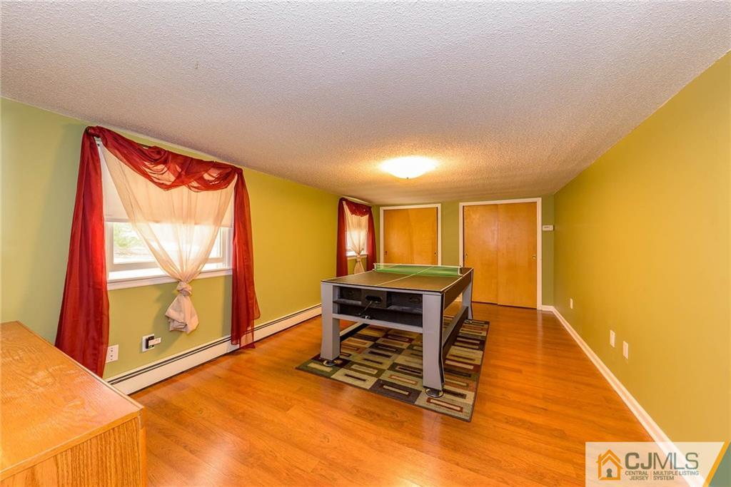 82 Jacobs Road Rockaway, NJ 07866 - Photo 4 of 25 a living room with furniture and a window