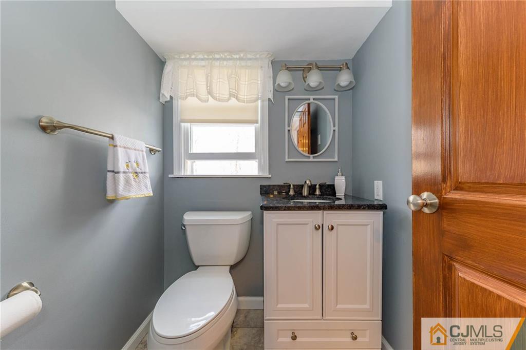 82 Jacobs Road Rockaway, NJ 07866 - Photo 8 of 25 a bathroom with a toilet a sink and a window