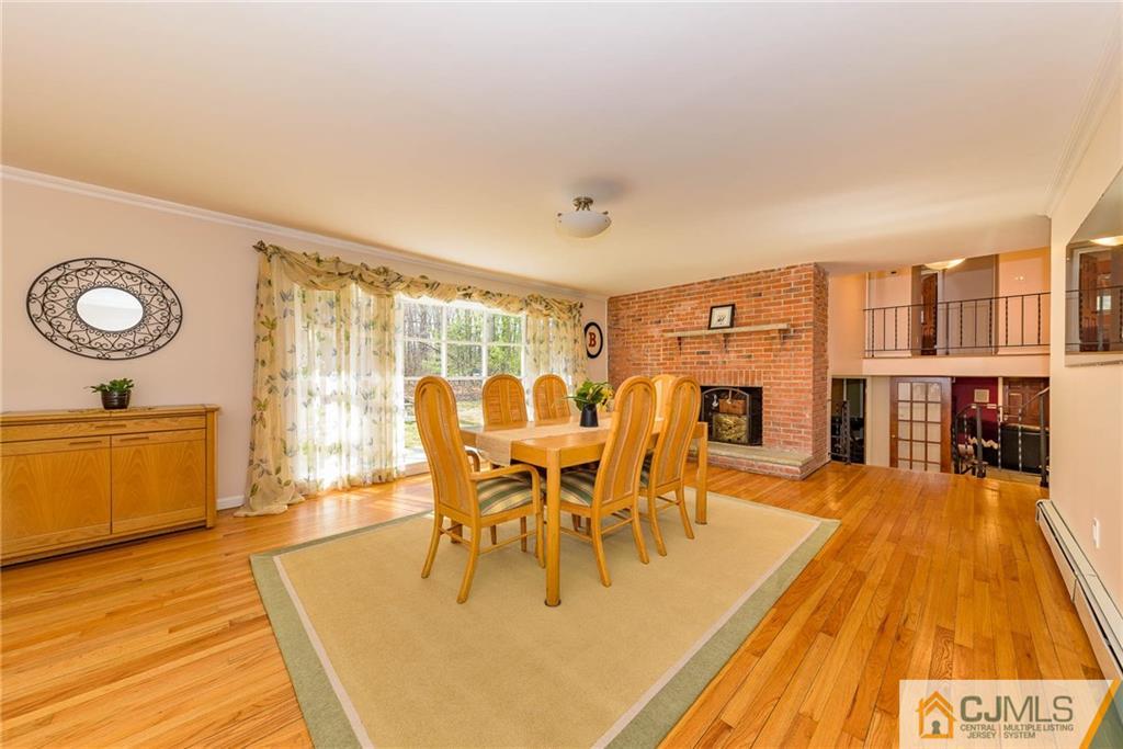 82 Jacobs Road Rockaway, NJ 07866 - Photo 10 of 25 a dining room with furniture a rug and wooden floor