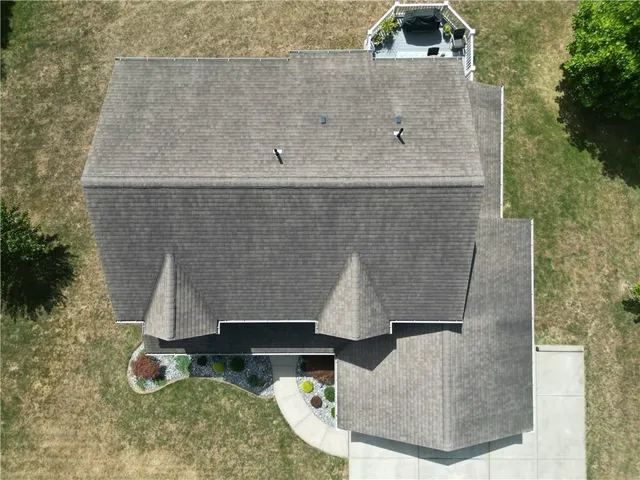 an aerial view of residential houses with outdoor space