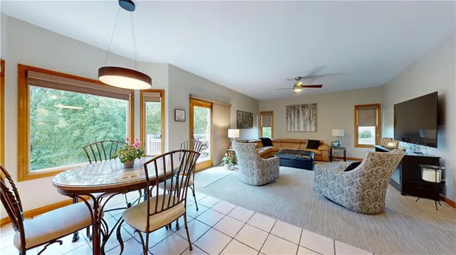 a view of a dining room with furniture window and outside view