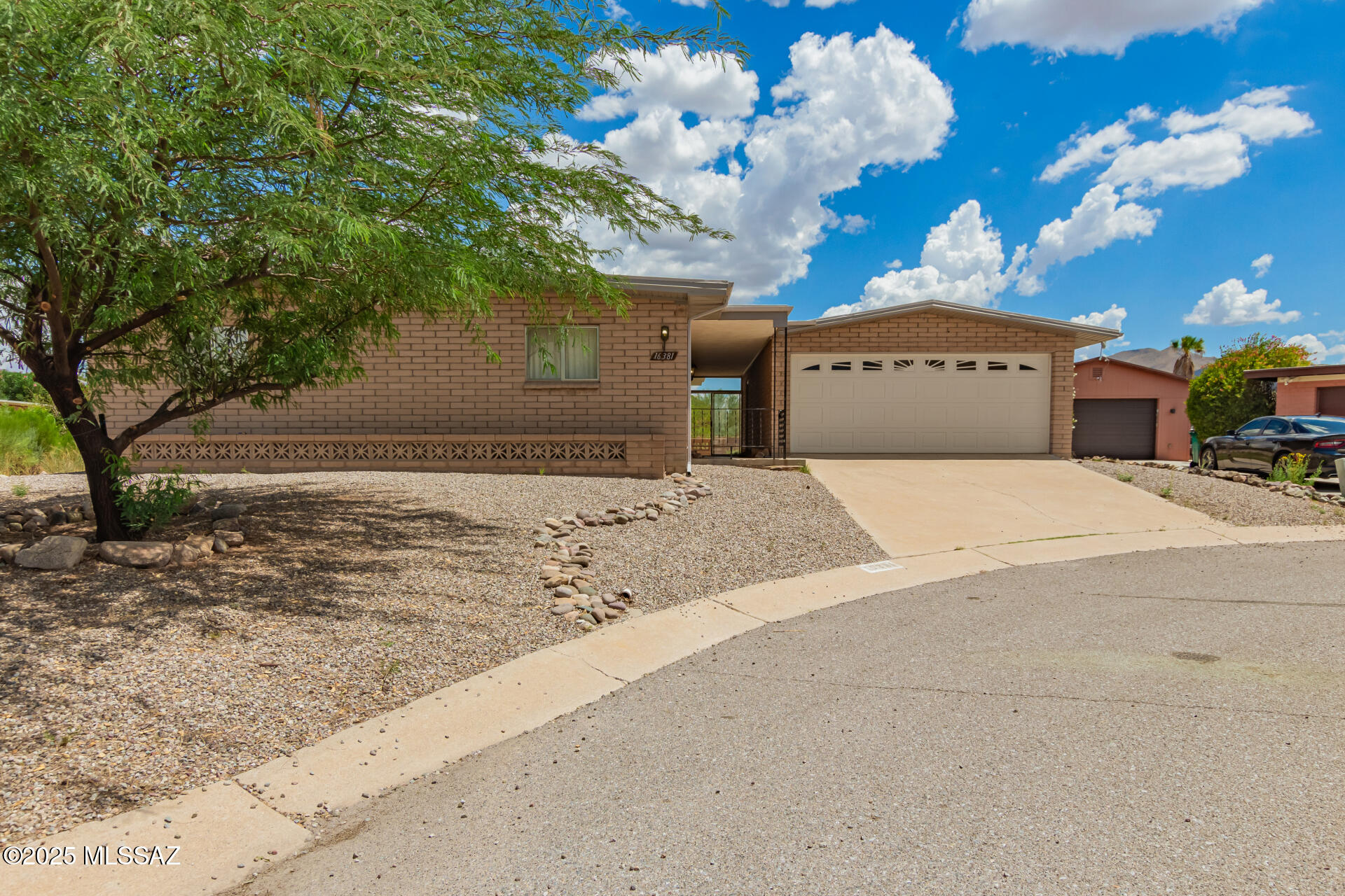 16381 South Observatory Place Vail, AZ 85641 - Photo 1 of 23 a front view of a house with a yard and garage