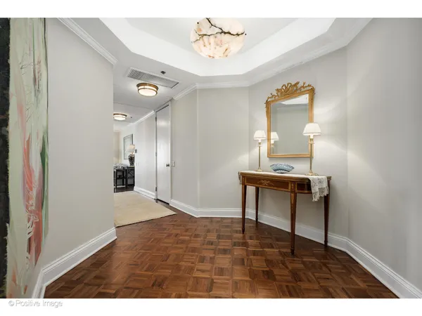 a view of workspace room with wooden floor