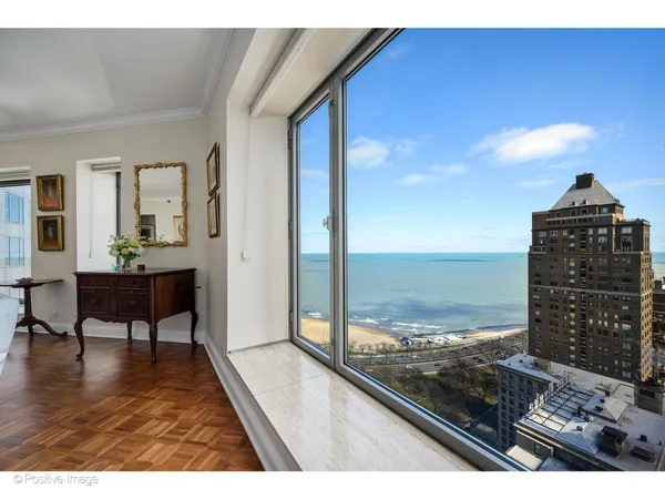 a view of a living room and hardwood floor