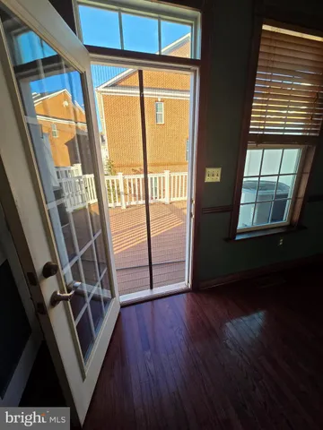 a view of an entryway with wooden floor