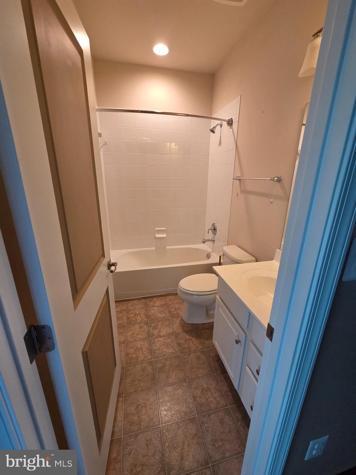 4500 Fait Avenue Baltimore, MD 21224 - Photo 21 of 28 a bathroom with a granite countertop sink toilet and shower