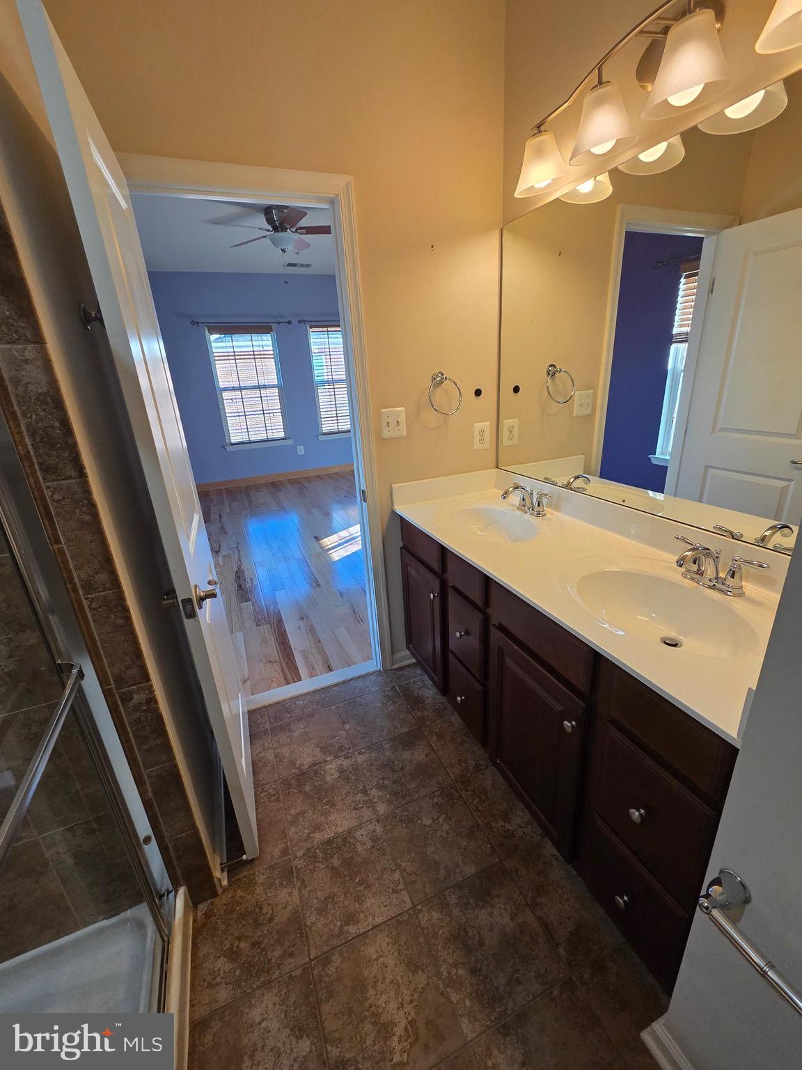 4500 Fait Avenue Baltimore, MD 21224 - Photo 25 of 28 a bathroom with a sink a vanity and a mirror