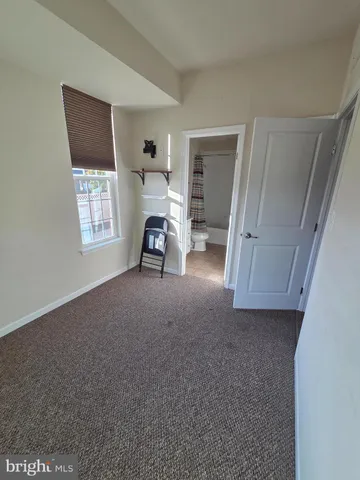 a view of room with window and workspace