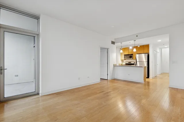 a view of a kitchen with a sink and cabinet