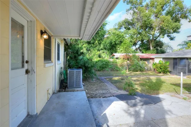 a view of a back yard from a patio