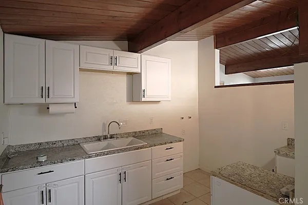 a bathroom with a sink and vanity