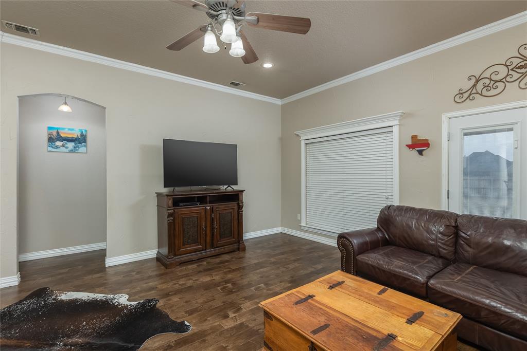 257 Reatta Drive Decatur, TX 76234 - Photo 12 of 39 a living room with furniture and a flat screen tv